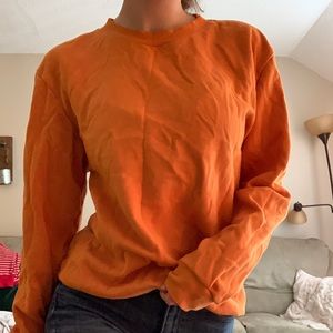 Divided orange crewneck